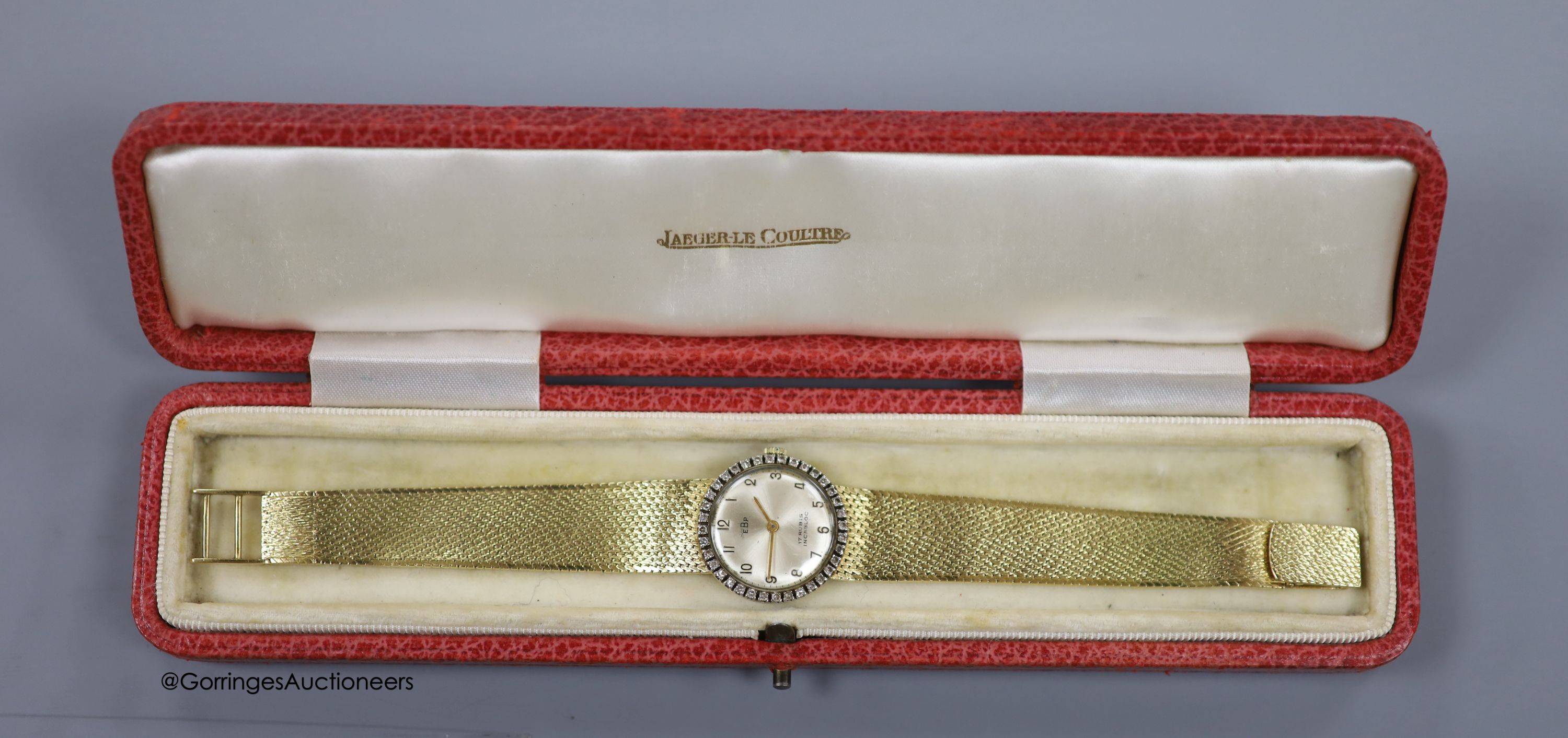 A lady's 18k and diamond set EBP manual wind wrist watch on an integral 750 mesh link bracelet, overall 19.5cm, gross weight 46.3 grams